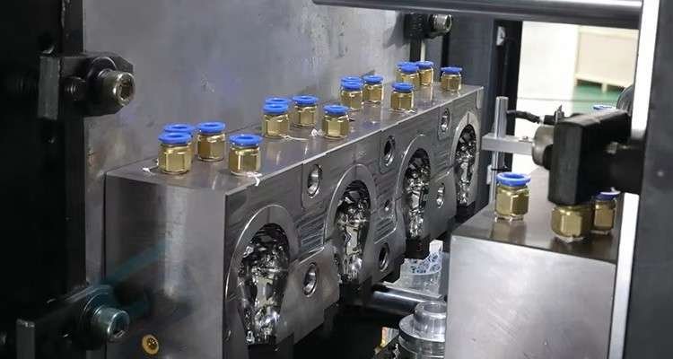 4 cavity precision CNC machined bottle mold assembly and high pressure blowing valves station in industrial PET blow molding machine — Sailwin