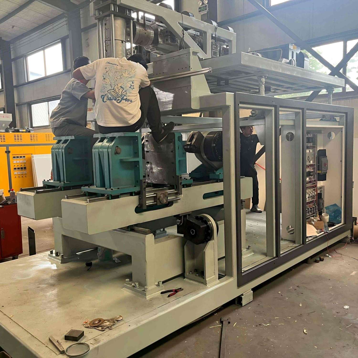 Heavy Duty Rigid Base Structure Assembly Heavy duty extrusion blow molding machine frame welding and base structure assembly in manufacturing workshop — Sailwin