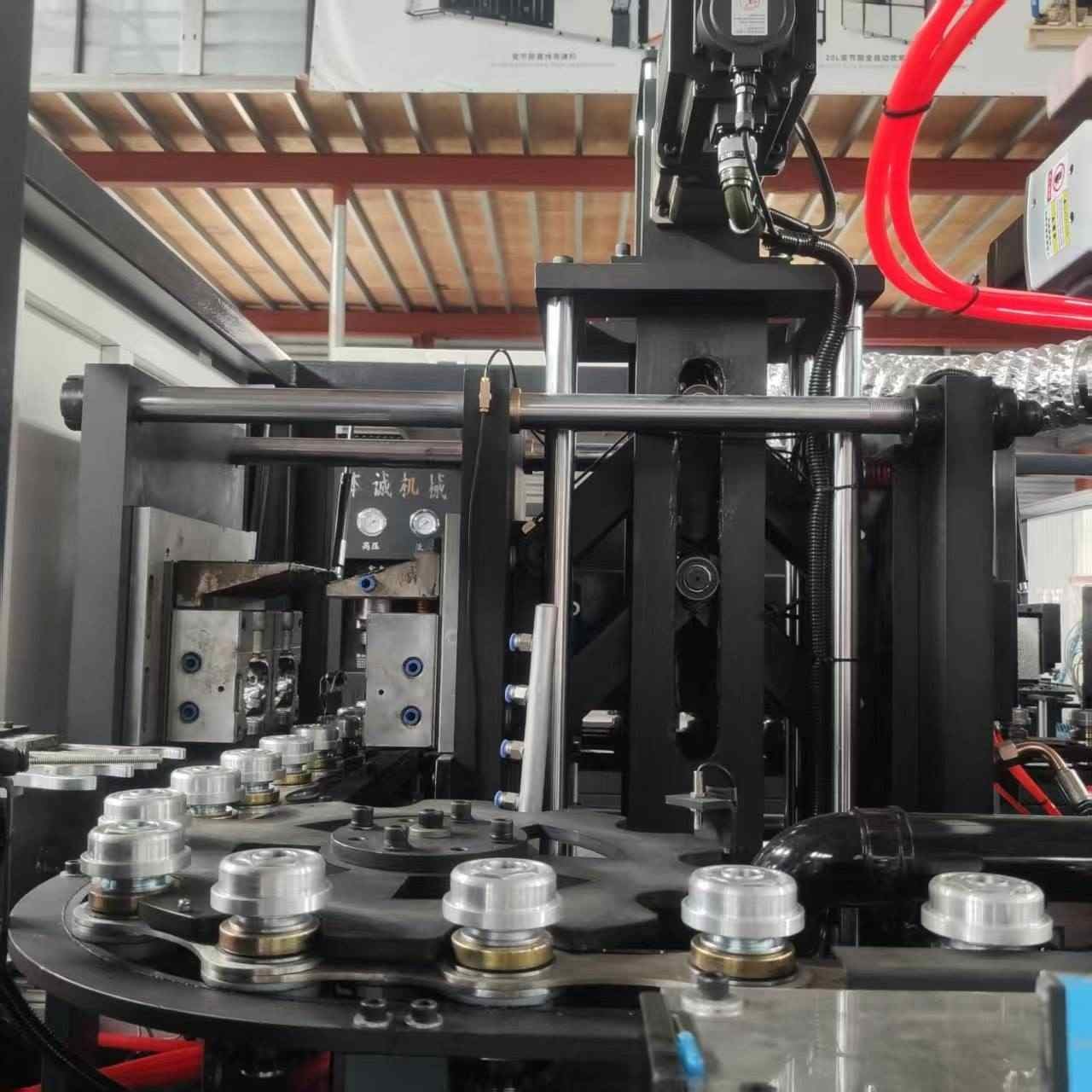 Rotary turntable mechanism and precision preform holder spindles engineered for high speed bottle blow molding lines — Sailwin