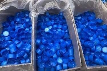 55mm Non-Spill Caps for 5 Gallon Water Bottles Standard 55mm non-spill plastic bottle caps and hygiene closures for 5 gallon PET water barrel packaging lines — Sailwin Machinery
